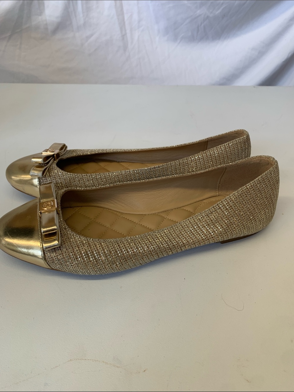 MICHAEL Michael Kors Gold Metallic Cap-Toe Ballet Flats with Bow Accent